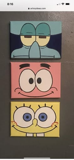 three cartoon characters painted on canvases mounted to the wall in a room with grey walls