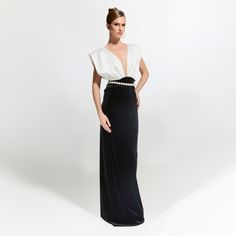 This black and white long dress, which makes a difference with its striking and sophisticated design, takes modern elegance to the highest level. The white satin upper part with a deep V-neck is designed in a voluminous and eye-catching way, and the pearl belt detail at the waist adds an elegant touch to the dress.  The lower part is designed in a form fitting black velvet fabric. Offering both minimal and luxurious details, this dress is guaranteed to be eye-catching at special events.  Handmad Black And White Long Dress, Black And White Long Dresses, White Long Dress, Pearl Belt, Black Velvet Fabric, Knit Loungewear, Happy Clothes, London College Of Fashion, Holiday Party Outfit