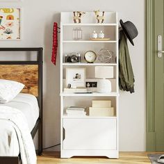 a bedroom with a white bookcase and green door