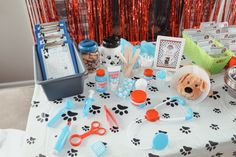 the table is set up with dog themed items