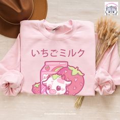 Introducing our adorable Kawaiicore Strawberry Milk Cow sweatshirt featuring the lovable Camilla, the cute strawberry cow! 🍓🐮 This sweatshirt is not only stylish but also designed to keep you cozy and warm during the colder months. Crafted with care, it boasts a pre-shrunk classic fit that ensures a comfortable and flattering silhouette. We believe in using high-quality materials, which is why this sweatshirt is made from a blend of 50% cotton and 50% polyester. The fabric has been air-jet spu Kawaii Clothes Outfits, Strawberry Milk Cow, Blueberry Cow, Kawaii Cottagecore, Plus Size Cute, Clothes Plus Size, Harajuku Outfits, Cute Cow, Cute Strawberry