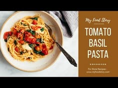 a white bowl filled with pasta and tomatoes