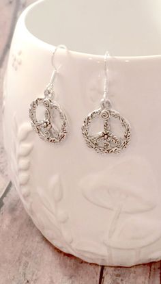 Cute peace sign earrings, a simple but elegant look for any outfit! The silver plated fishhook ear wires measure 3/4" x 7/10", and the zinc alloy peace sign charms measure 4/5" x 2/3" (Total length is approximately 1 1/2") All items are lead and nickel free, message with any questions, thanks! Earth Earrings, Peace Hand Sign, Peace Sign Jewelry, Peace Sign Earrings, Peace Jewelry, Peace Earrings, Peace Hand, Earth Gift, Tyler Tx