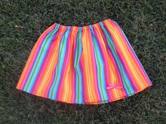 a colorful skirt laying on the grass