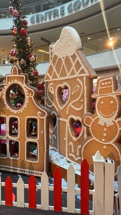 a large gingerbread house in the middle of a mall