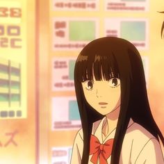 two anime characters standing next to each other in front of a wall with signs on it