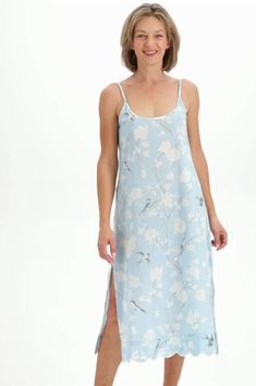 Always in style, Heidi's classic slip nightgown promises a peaceful sleep draped in super soft, lightweight cotton. The subtly feminine silhouette with flowing skirt and fitted bust offers an alluring alternative to traditional shift nightgowns, while a contrasting scalloped hem adds a sophisticated finish you won't find in everyday sleepwear. Offered here in a hand-painted pale blue gardenia print, this night-to-day essential brings you firmly into the now with a hint of Old World glamor. Slip Slip Nightgown, Peaceful Sleep, Feminine Silhouette, Flowing Skirt, Nightgowns, Scalloped Hem, Pale Blue, Night Gown, Sleep