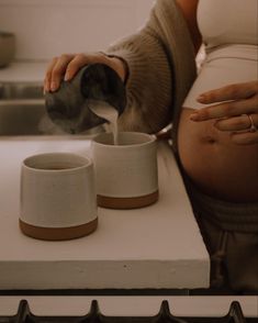 Mom to be pouring coffee Maternity Photo Shoot Home, Casual Maternity Shoot At Home, Cozy In Home Maternity Session, Pregnancy Aesthetic Faceless, Nesting Aesthetic, Home Maternity Photography Ideas, Pregnant Couple Aesthetic, Lifestyle Maternity Shoot At Home, Cozy Maternity Shoot