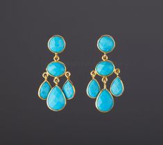 An exquisite piece of art work, this pair of three-tier turquoise earrings would be nice reward for yourself or a great gift for your mother or best friend. Each one has three layers of turquoise stones set in leaflet shaped, gold plated bezels and laid in a dangling willow branch pattern. 1. Stones : turquoise (reconstituted stabilized) 2. Stone shape and size: top tier: a bezeled round turquoise 10mm middle tier: a bezeled oval turquoise 14 x 10 mm bottom tier: three dangling pear shaped turqu Affordable Traditional Turquoise Beaded Earrings, Turquoise Wedding Jewelry Earrings, Turquoise Chandelier, Earring Frame, Turquoise Earring, Engraved Locket, Earring Ideas, Mother Birthday Gifts, Three Tier