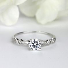 a white gold engagement ring with diamonds on it