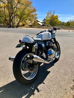 the motorcycle is parked on the side of the road