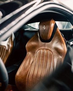 the interior of a car with leather seats