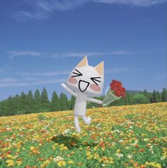 a white cat holding a red rose in a flower filled field with trees and grass