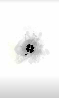 an abstract black and white painting with four leaf clovers on it's side