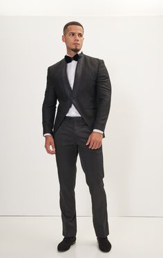 DETAILS A black-tailored tuxedo with a mandarin collar with a textured feel to it, a modern and stylish take on the traditional tuxedo. The texture on the fabric adds visual interest and depth to the overall design, creating a unique and eye-catching tuxedo. Features a single button closure, creating a sleek and modern design. Pair with any Tomson Tuxedo Pants SIZE + FIT Tailored fit, to find your correct size use the ''What's my size'' button. Our jackets have a tailored fit, which requires min Black Tuxedo With Structured Boning, Black Tailored Tuxedo With Button Closure, Designer Black Single-breasted Tuxedo, Luxury Tailored Single-button Tuxedo, Black Wool Single-breasted Tuxedo, Tuxedo Pants, Black Tuxedo, Tuxedo Jacket, Mandarin Collar