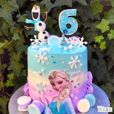 a frozen princess birthday cake on a table