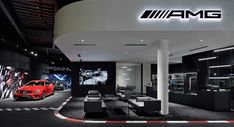 the interior of an automobile showroom with cars on display