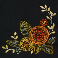 an embroidered design with leaves and flowers on a black background