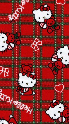 a hello kitty plaid fabric with hearts and bows on the front, in red and green