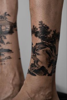 two people with tattoos on their legs