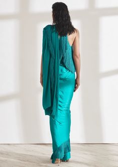 Our noor fringe sari features a full pre-draped sari that looks like a regular sari with our signature fringe detail. Pair it with the halter fringe top or get in touch for more blouse options. Elegant Party Pre-draped Saree With Tassels, Bollywood Party Pre-draped Saree With Tassels, Party Dress With Tassels In Traditional Drape, Party Dress With Tassels And Traditional Drape, Pre-draped Saree With Tassels For Wedding, Bollywood Style Saree With Tassels For Reception, Wedding Pre-draped Saree With Tassels, Elegant Saree With Tassels For Reception, Elegant Pre-draped Saree With Tassels For Wedding