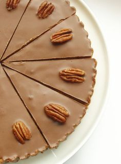 there is a chocolate pie with pecans on top