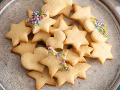 some cookies are on a plate with sprinkles