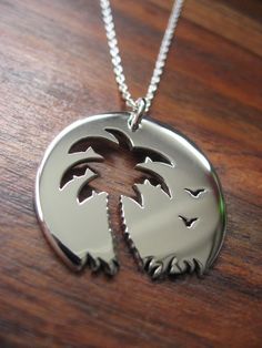 Palm tree Sunset Birds Pendant Necklace on Etsy, $65.18 Sterling Silver Laser Engraved Pendant, Laser Engraved Sterling Silver Pendant, Laser Engraved Sterling Silver Necklace, Laser Engraved Sterling Silver Jewelry, Etched Stainless Steel Silver Jewelry, Sterling Silver Pendant Necklace With Laser Engraving, Beach Palm Tree Tattoo, Tree Leaves Tattoo, Leaves Tattoo