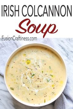 a white bowl filled with soup on top of a marble counter next to a blue towel