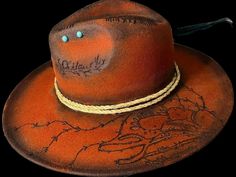 The burnt sunset color, the desert design, outlaw branded and Stay Wild at heart proudly exclaimed. The perfect accessory to unleash your wild, untamed spirit! This one-of-a-kind cowboy hat pays homage to the rich heritage of the old west, ensuring you stand out from the crowd with its unique and rugged charm. Please NOTE: This hat is a custom made to order. It can take up to 4 weeks between order and product delivery.       *All hats will be as close to original design, but may vary according t Handmade Western Hat For Western-themed Events, Red Western Felt Hat For Festival, Handmade Western Fedora For Western-themed Events, Country Style Festival Hat Bands With High Crown, Handmade Western Fedora With High Crown, Handmade High Crown Western Fedora, Orange Curved Brim Hat For Festivals, Orange Bohemian Hat For Festival, Orange Bohemian Festival Hat