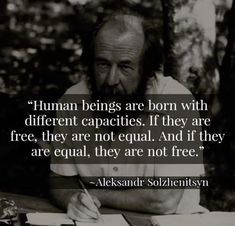 a man sitting at a table with a pen and paper in front of him that says human beings are born with different capabilitiess, if they are free, they are not equal