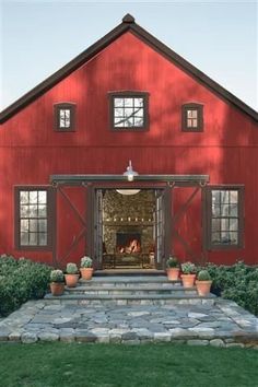 an image of a red barn with a fire place