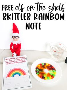 an elf on the shelf with skittles rainbow note next to it and a bowl of gummy bears