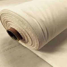 a roll of white cotton sitting on top of a table