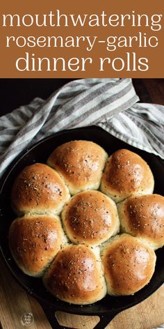 a pan filled with rolls on top of a wooden cutting board