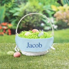 an easter basket with eggs in it on the grass