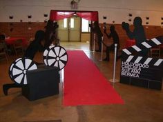 a red carpet with black and white signs on it