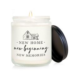 a candle with the words new home, new beginnings and memories on it in front of a white background