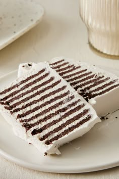 two pieces of cake sitting on top of a white plate