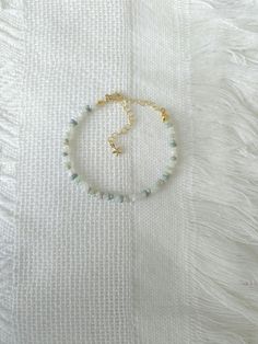 FOR OTHER DAINTY BEADED BRACELETS: https://www.etsy.com/ca/shop/ArtiChouXCanada?ref=seller-platform-mcnav%C2%A7ion_id§ion_id=46088511 Bracelet Length: 13-18cm (5.1-7 inches) with a 14k gold filled extender.  This bracelet features an assortment of pastel colors: white, gray and different shades of green Japanese seed beads.  Thread may be visible since it is a handmade product   SIZING  Wrap a soft measuring tape snugly around the widest part of your wrist. Add 1.27cm (0.5in) to that measurement Colorful Bracelet, Different Shades Of Green, Seed Bead Bracelet, Bracelet Dainty, Seed Bead Bracelets, Measuring Tape, Colorful Bracelets, Gold Filled Jewelry, Clay Beads