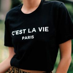 A Classic Black Graphic T-Shirt Featuring The C’est La Vie Paris Logo. As Seen On Paris + Me Website For $65! Bella + Canvas Premium 100% Cotton Tee Runs Oversized Classic Tee Shirt Sizing S - 2/4 M - 6/8 L - 10/12 Paris Landscape, Black And White Graphic Tee, Paris Graphic, Moon Graphic Tee, Paris Logo, Paris T Shirt, White Graphic Tee, Frayed Denim, Cool Tees