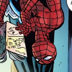 the spider - man is looking down at his drawing