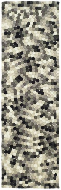 an area rug with black and white squares on it