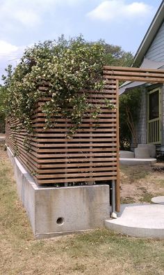 a wooden structure sitting in the middle of a yard