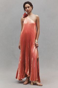 Crafted from metallic silk, this one-shoulder pleated maxi dress will have you shimmering on the dance floor. A floral embellishment on the shoulder adds an extra flair for any event. | Daria Dress by Delfi Collective in Pink, Women's, Size: Large, Metal/Silk at Anthropologie Elegant Wedding Guest Dress Summer, Disco Wedding Outfit, Funky Formal, Formal Wedding Guest Attire, Optical Illusion Dress, Formal Wedding Attire, Ombre Maxi Dress, Floral Embellishment, Dress Code Wedding