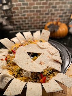 tortilla wraps are arranged in the shape of the letter g