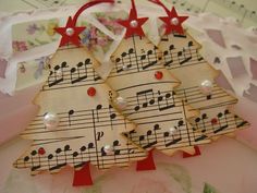 two decorated christmas trees with musical notes on them