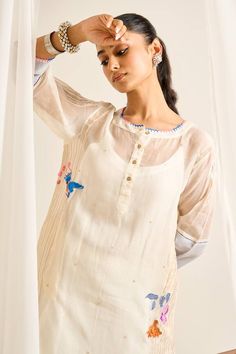 Off white three fourth sleeves kurta with Tulip bird paradise embroidery and pocket detail. Paired with a double scallop hem embroidered sheer hem pant and an inner. - Aza Fashions Festive White Top With Embroidered Sleeves, Festive White Blouse With Embroidered Sleeves, White Embroidered Straight Kurta Blouse, Festive White Kurta With Embroidered Neckline, White Embroidered Straight Kurta Top, Festive White Straight Kurta Top, White Embroidered Sleeves Straight Kurta, White Kurta With Embroidered Neckline For Spring, White Embroidered Kurta For Spring