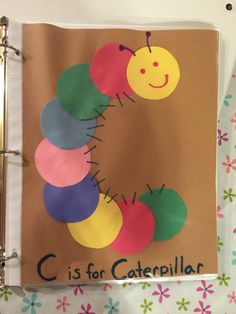 the very hungry caterpillar is made out of construction paper and cut into circles