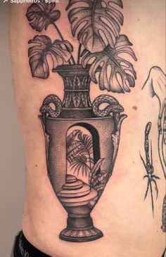 a woman's stomach with a vase and plants on it